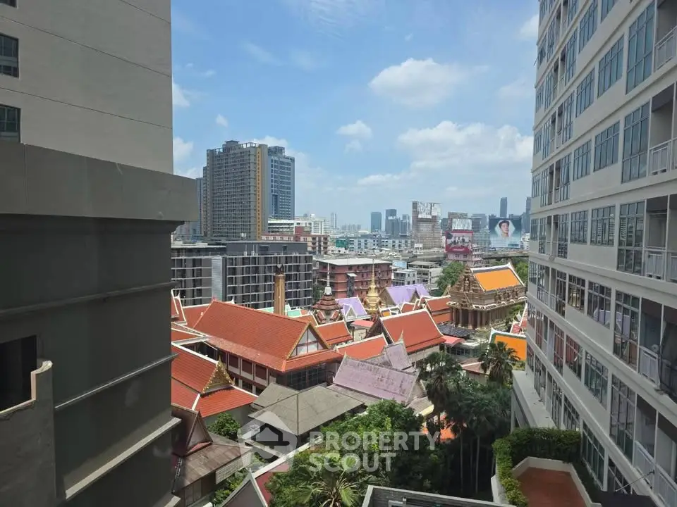 Stunning cityscape view from high-rise building with vibrant rooftops and skyline.