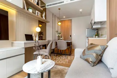 Modern living room with stylish decor and open kitchen layout