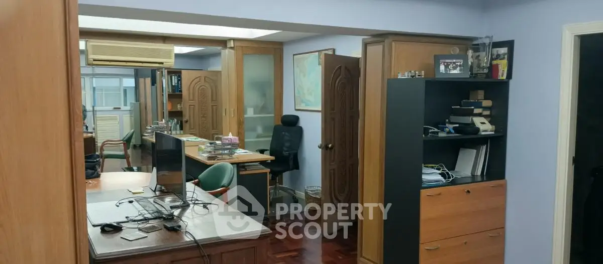 Spacious study room with modern furniture and ample storage space