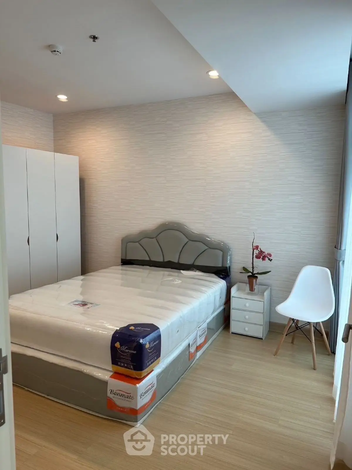 Modern bedroom with stylish furniture and natural light