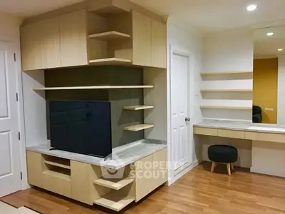 Modern living room with custom wooden shelving and sleek TV setup