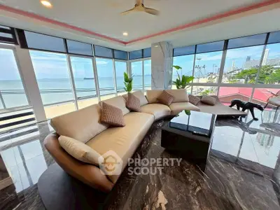 Luxurious living room with panoramic ocean view and modern furnishings