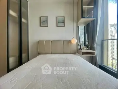 Modern bedroom with large window and stylish decor in urban apartment