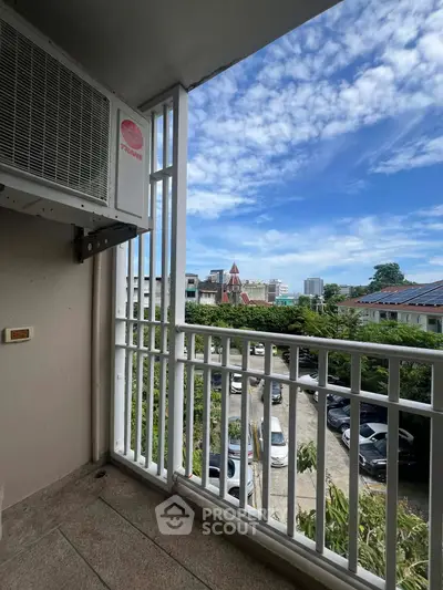 Charming balcony with city view, perfect for relaxing and enjoying the skyline.