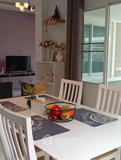 Charming dining area with modern decor and natural light, perfect for family gatherings.