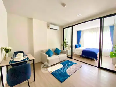 Modern studio apartment with cozy living area and stylish bedroom