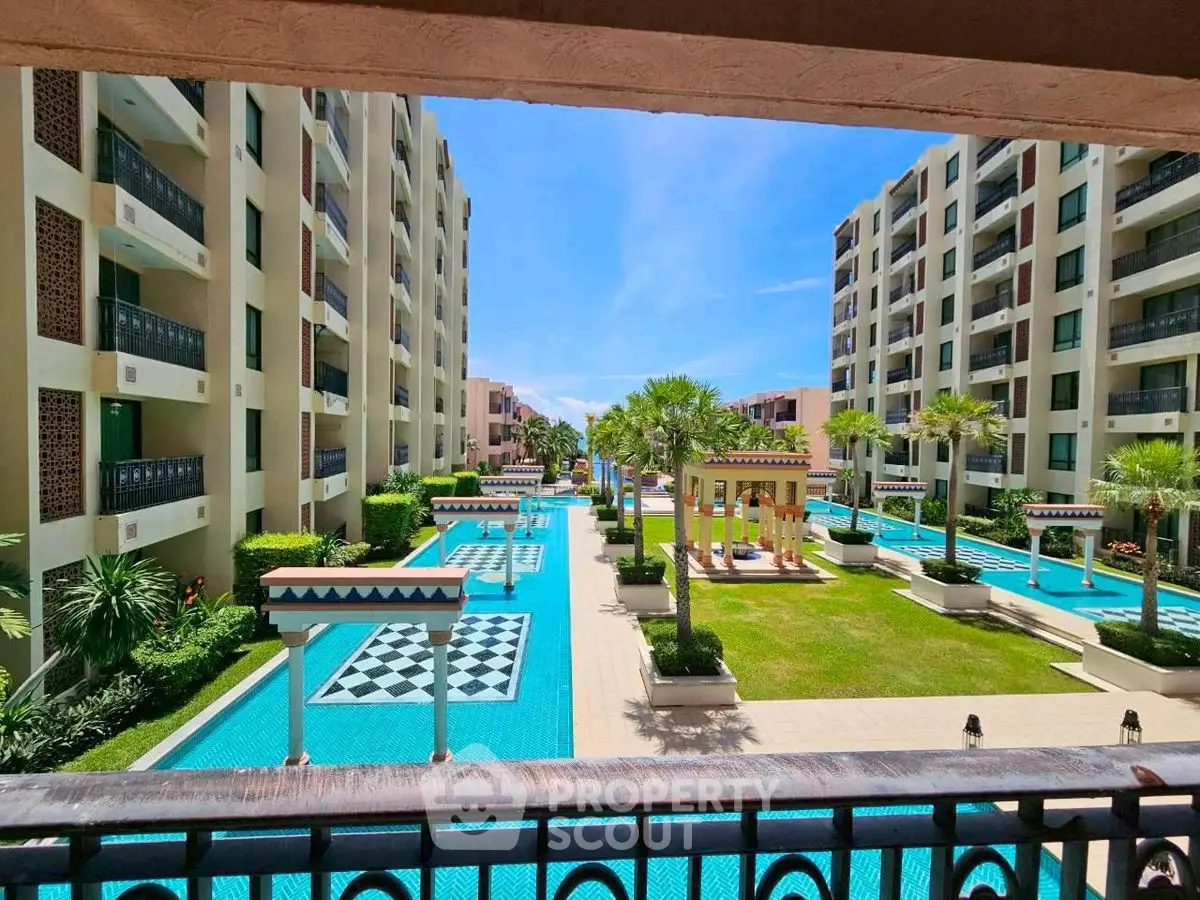 Luxurious apartment complex with stunning pool and garden view