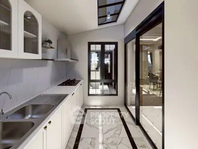 Modern kitchen with sleek design, marble flooring, and large windows for natural light.