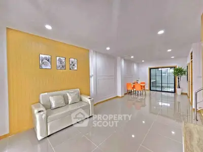 Spacious modern living room with sleek design and vibrant dining area