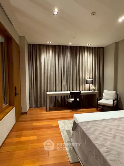 Luxurious modern bedroom with unique wall design and elegant furnishings.