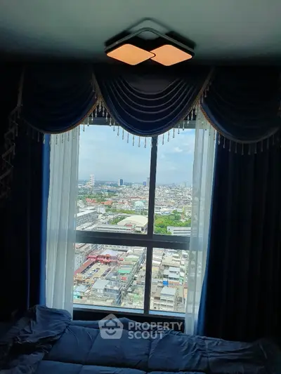 Luxurious high-rise bedroom with stunning city view through large window
