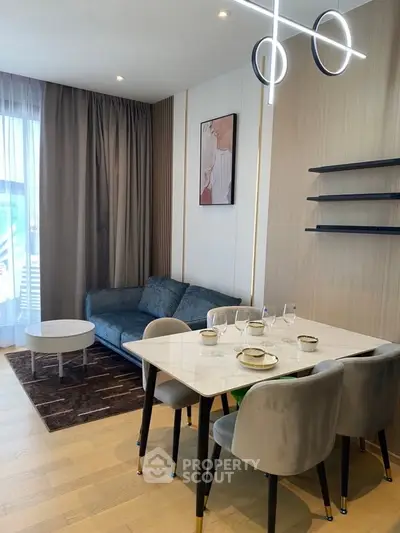 Modern living room with elegant dining area and stylish decor