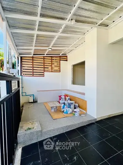 Modern covered patio with sleek design and renovation materials