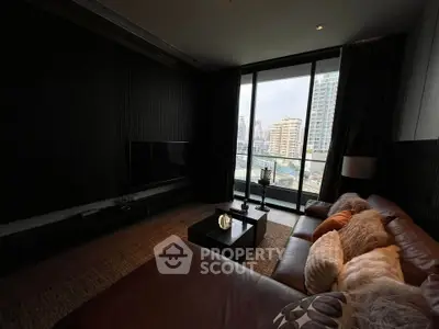 Luxurious living room with city view, modern decor, and cozy seating area.