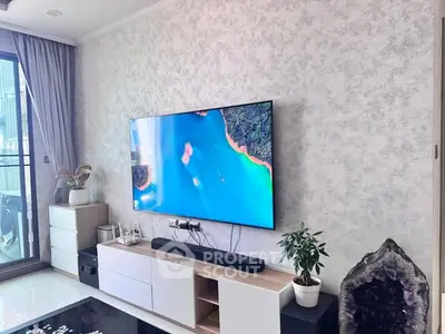 Modern living room with large TV and stylish decor