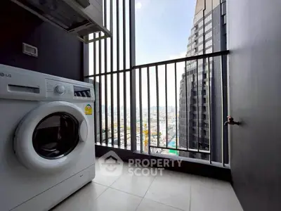 Modern apartment balcony with washing machine and city view