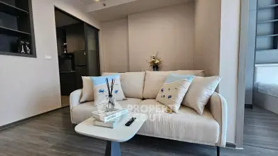 Modern living room with cozy sofa and stylish decor in a contemporary apartment.