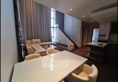 Luxurious modern living room with high ceilings and elegant decor