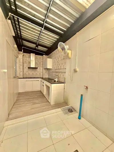 Spacious kitchen with modern open layout and ample natural light