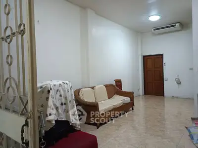 Spacious living room with minimalist decor and air conditioning