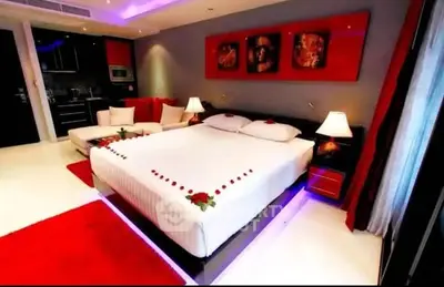 Luxurious bedroom with modern decor and ambient lighting in a stylish apartment.