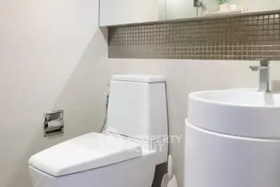 Modern bathroom with sleek fixtures and contemporary design.