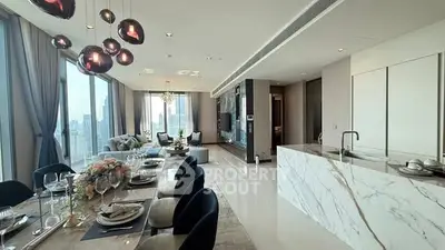 Luxurious open-plan living and dining area with stunning city views and modern decor.