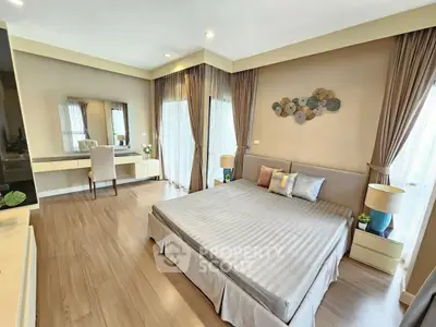 Spacious modern bedroom with elegant decor and natural light