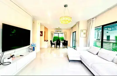 Spacious modern living room with elegant decor and large windows for natural light