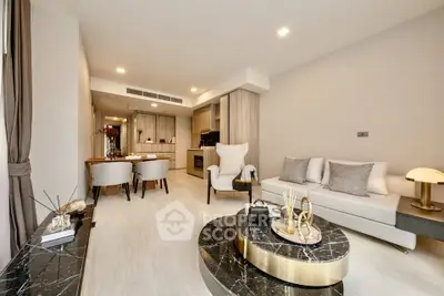 Luxurious modern living room with elegant decor and open kitchen layout