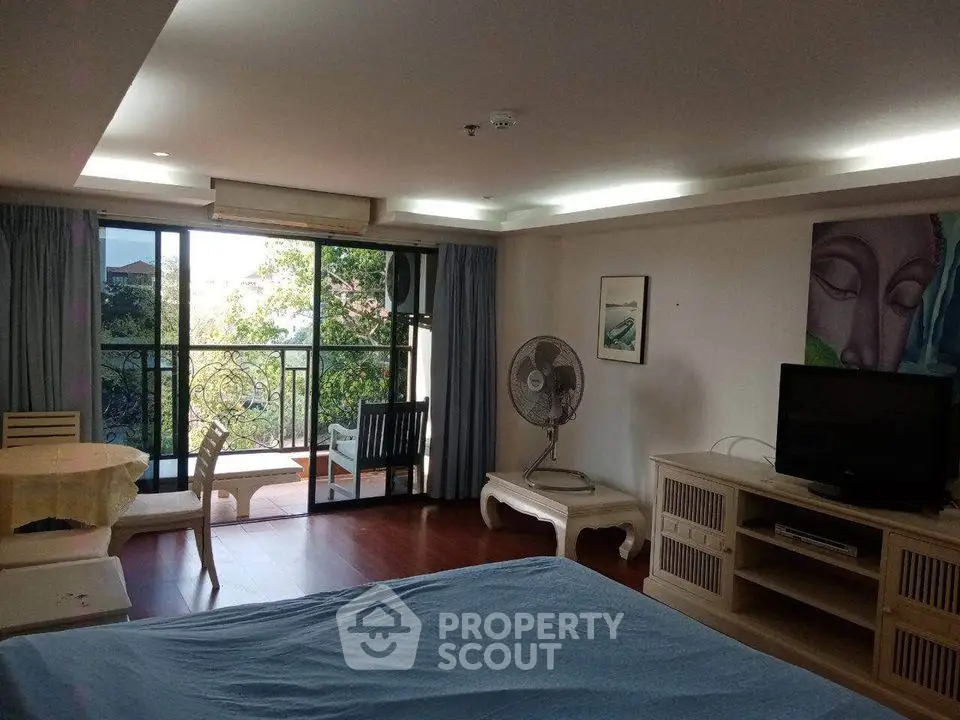 Spacious living room with balcony and modern decor