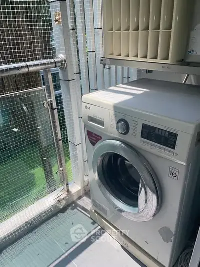 Compact balcony with washing machine and air conditioning unit