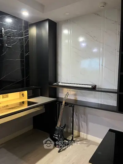 Stylish modern study room with sleek black and white decor, featuring a guitar and keyboard for music enthusiasts.