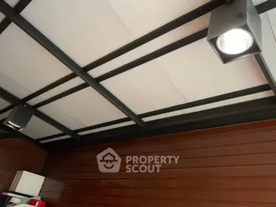 Modern ceiling with spotlight in stylish interior space