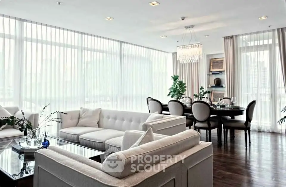 Luxurious modern living room with elegant dining area and large windows
