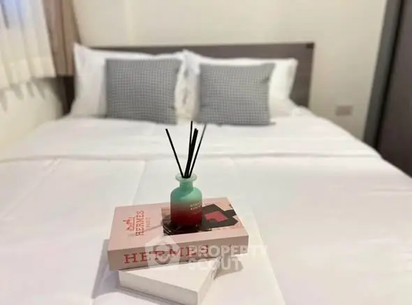 Cozy bedroom with stylish decor and luxurious bedding, perfect for relaxation and comfort.