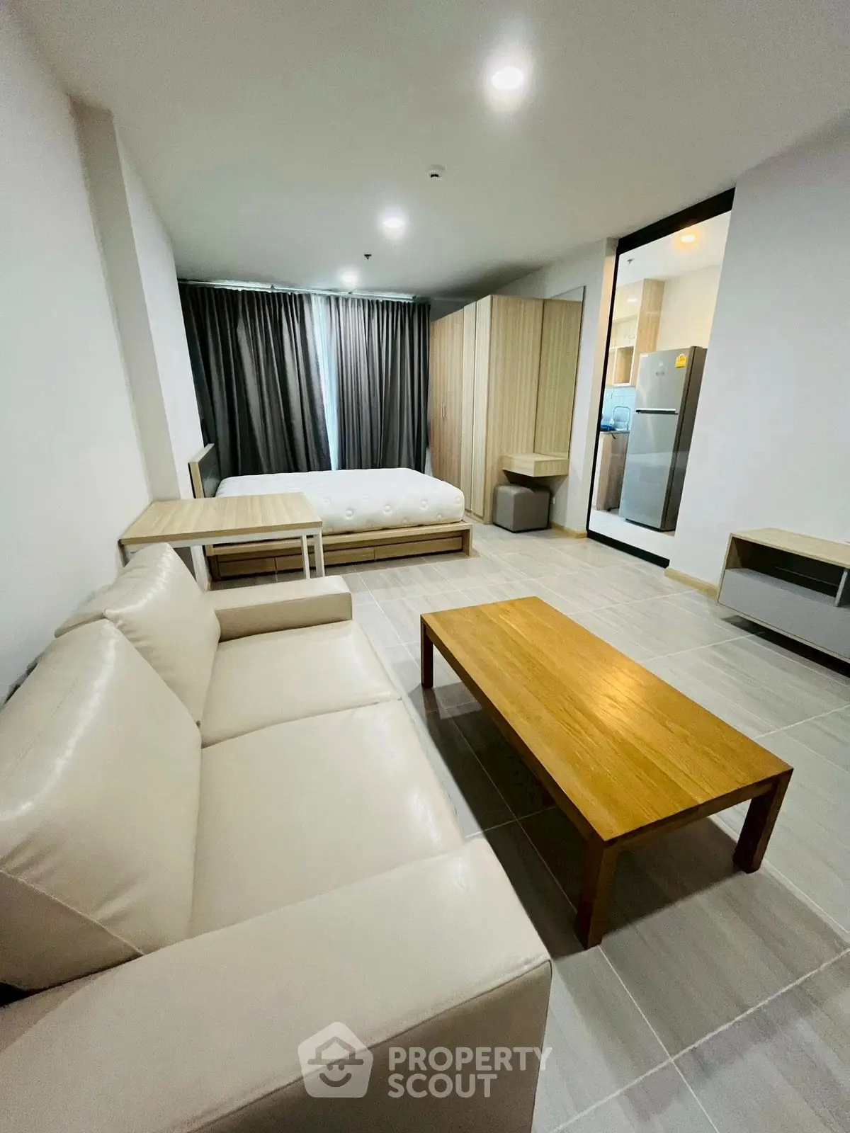 Modern studio apartment with sleek furniture and open layout