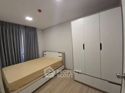Modern bedroom with sleek wardrobe and cozy bed in minimalist design