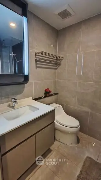 Modern bathroom with sleek fixtures and elegant tile design