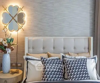 Elegant bedroom with stylish decor and plush pillows