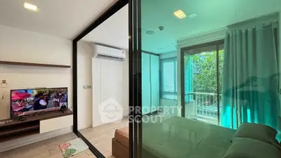 Modern apartment with glass partition, cozy living area, and bright bedroom with balcony view.