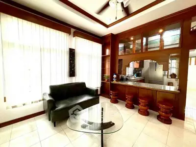 Elegant living room with modern furniture and wooden accents