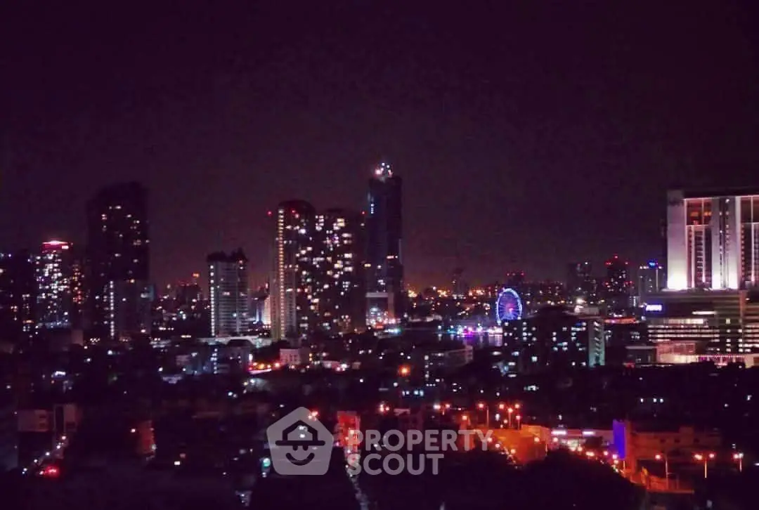 Stunning city skyline view at night with illuminated skyscrapers and vibrant city lights.