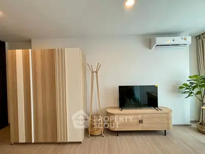 Modern living room with stylish wooden furniture and air conditioning