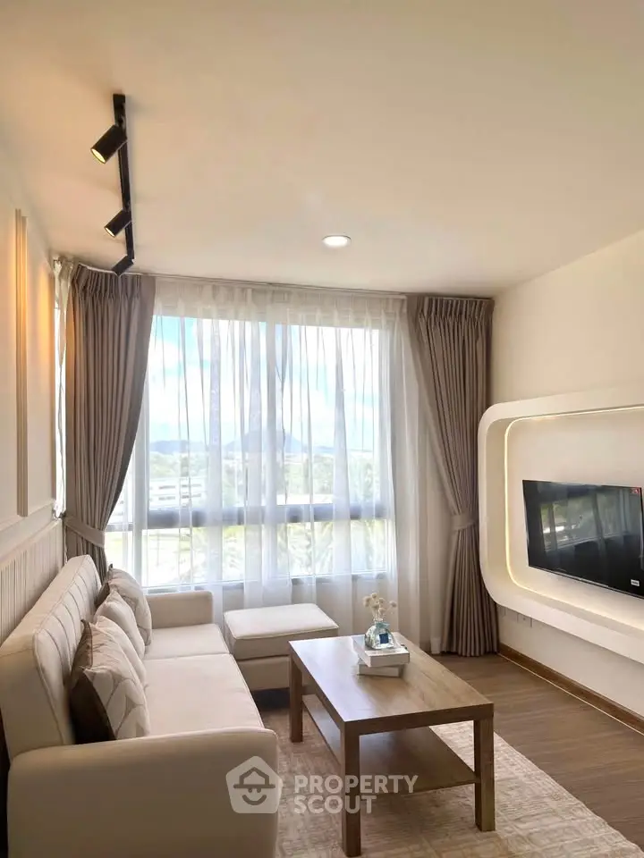 Bright and modern living room with large window and stylish decor