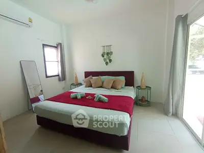 Cozy bedroom with modern decor and natural light