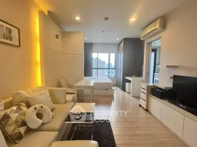 Modern open-plan living room with cozy seating and city view