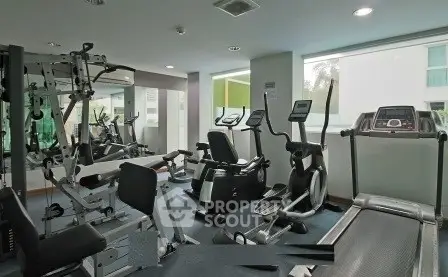 Modern gym with state-of-the-art fitness equipment in a residential building.