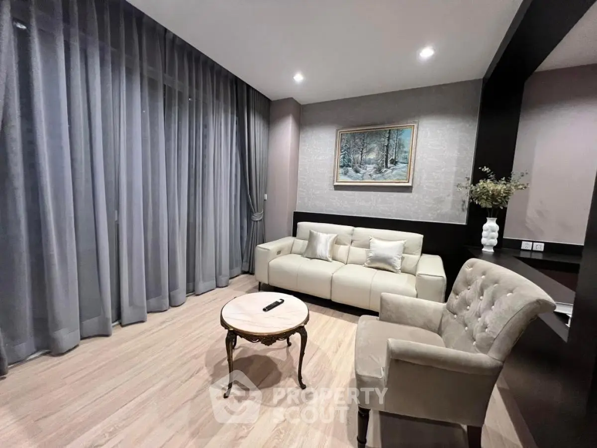 Elegant living room with modern decor and cozy seating area