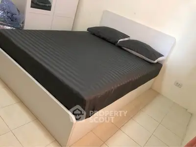 Modern bedroom with sleek design and comfortable bed in a cozy setting.